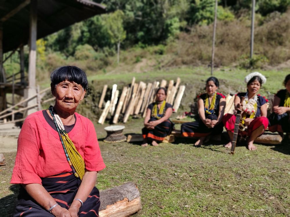 An Adi elder leading a folk song in Gete village